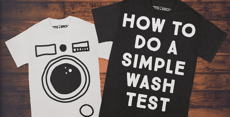 A white and a black t-shirt over a wood background. How to fo a simple wash test is printed on the black t-shirt. The white t-shirt has a washing machine front printed on.